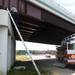 Ann Arbor firefighter Lieutenant Keith Harr climbs a ladder to rescue a stray cat found under an overpass along I-94 on Tuesday. Photos courtesy of Humane Society of Huron Valley